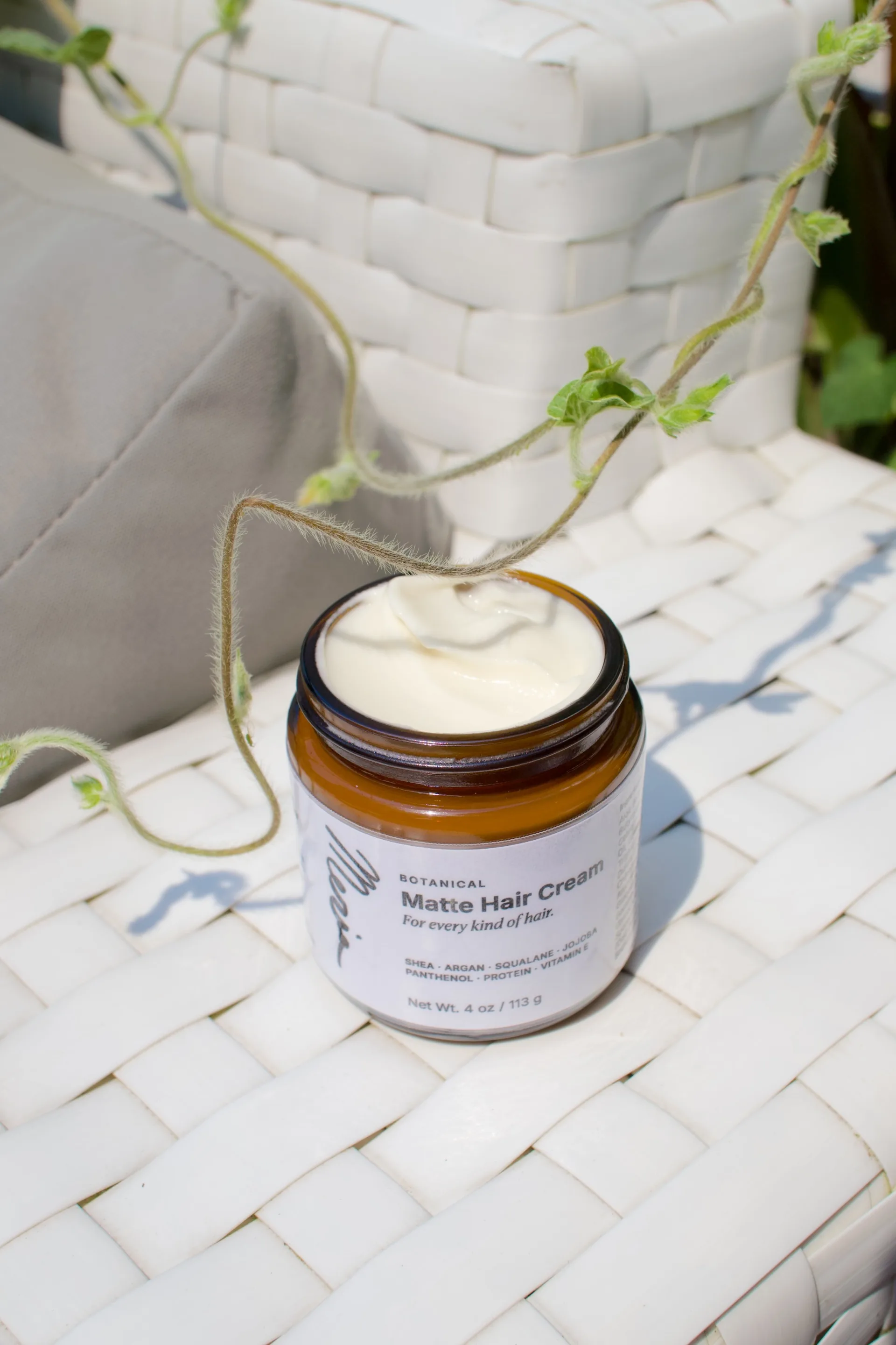 A jar of Meria Botanical Matte Hair Cream